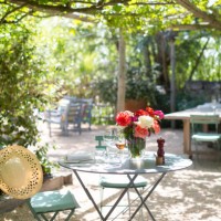 garden table set-up with flowers - garden decoration stock pictures, royalty-free photos & images