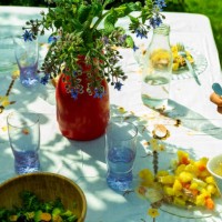 garden table with white tablecloth and food on a spring day - garden decoration stock pictures, royalty-free photos & images