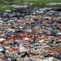 garment factory waste dump contributes to environmental issues in bangladesh - fashion stock pictures, royalty-free photos & images