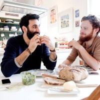 gay couple eating lunch at home - food stock pictures, royalty-free photos & images