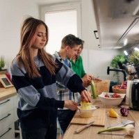 generation z teenagers making salad in kitchen - food stock pictures, royalty-free photos & images