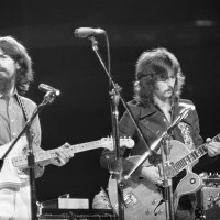George Harrison and Eric Clapton performing at the Concert for Bangladesh at Madison Square Garden.