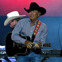 George Strait performs on stage during ATLive 2021 concert at Mercedes-Benz Stadium on November 05, 2021 in Atlanta, Georgia.