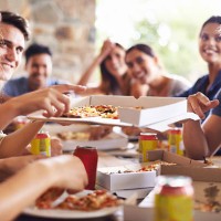 getting together for pizza - junk food stock pictures, royalty-free photos & images