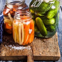 gherkins fermenting, gherkins and carrots in preserving jars - food stock pictures, royalty-free photos & images