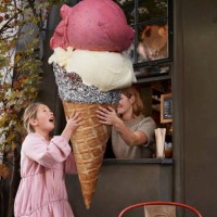 girl buying large ice cream from take out counter of cafe - junk food stock pictures, royalty-free photos & images
