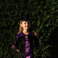 girl in a festive costume outside. halloween. candy or death. pumpkin. holiday. masquerade. - garden decoration stock pictures, royalty-free photos & images