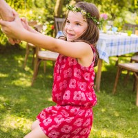 girl pulling adult's arm in garden - garden decoration stock pictures, royalty-free photos & images