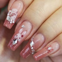 Girl shows a Chinese zodiac rabbit nail art in Lianyungang City, East China's Jiangsu Province, Jan 11, 2023.