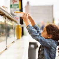 girl taking hot dog from food truck - junk food stock pictures, royalty-free photos & images