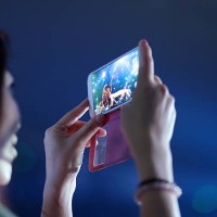 Girl used mobile phone camera take pictures In the Concert party