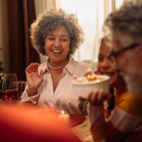 girl with grandparents at christmas lunch - food stock pictures, royalty-free photos & images