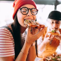 girlfriends eat pizza - food stock pictures, royalty-free photos & images