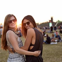 girlfriends posing to camera at big festival - concert stock pictures, royalty-free photos & images