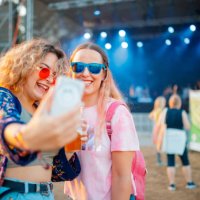 girlfriends taking selfie on daytime outdoor music festival - concert stock pictures, royalty-free photos & images