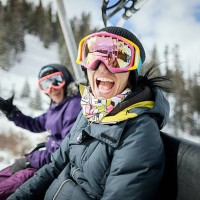 girls laughing and having fun on a chair lift. - fashion stock pictures, royalty-free photos & images