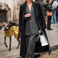 Giulia Arena wears grey suit, black maxi coat, outside Blumarine, during the Milan Fashion Week - Womenswear Fall/Winter 2024-2025 on February 23,...