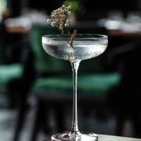 glass goblet of transparent cocktail garnished with flowers - food stock pictures, royalty-free photos & images