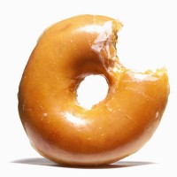 glazed doughnut with missing bite - food stock pictures, royalty-free photos & images