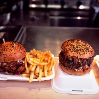 gourmet burgers and french fries against blurred background - junk food stock pictures, royalty-free photos & images