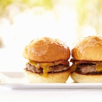 gourmet hamburgers against nature background - junk food stock pictures, royalty-free photos & images