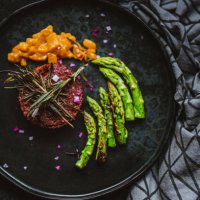 gourmet vegan burger served with grilled asparagus and mango chutney - food stock pictures, royalty-free photos & images