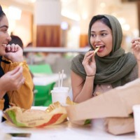 grabbing a bite to eat - junk food stock pictures, royalty-free photos & images