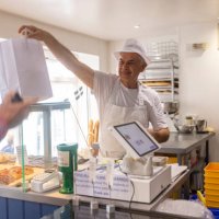grabbing food to go - junk food stock pictures, royalty-free photos & images