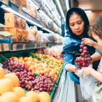 grand mother and her grandson buyung fruit in the supermarket - food stock pictures, royalty-free photos & images