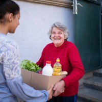 grandchild delivering freshness food to her grandmother. - food stock pictures, royalty-free photos & images