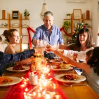 grandfather proposing a toast at christmas dinner in buenos aires - food stock pictures, royalty-free photos & images