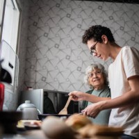 grandson and grandmother cooking at home - food stock pictures, royalty-free photos & images