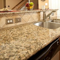 granite kitchen counter with dishwasher underneath. sink. bar. - home decoration stockfoto's en -beelden