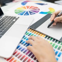 graphic designer at work. color swatch samples. artist drawing something on graphic tablet at the office. graphic designer creativity editor ideas designer concept - fashion stock pictures, royalty-free photos & images