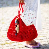 Grece Ghanem wears white skirt, red bag outside Herskind during day three of the Copenhagen Fashion Week SS25 on August 07, 2024 in Copenhagen,...
