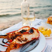 greece, cyclades islands, mykonos, lobser dinner at coast - food stock pictures, royalty-free photos & images