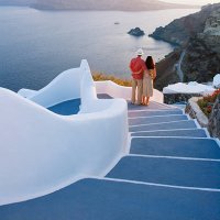 greece, the cyclades, santorini, couple embracing on steps, rear view - travel stock pictures, royalty-free photos & images
