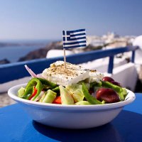 greek salad served by the water in santorini, greece - food stock pictures, royalty-free photos & images