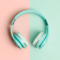 green headphones on a green and salmon background - fashion stock pictures, royalty-free photos & images