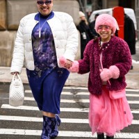 Greivy Lou is seen wearing a Ann Taylor jacket, Misook dress, Prada boots, Brahmin bag, Karl Lagerfeld sunglasses, Lagos & German Kabirski rings,...