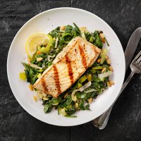 grilled halibut with spinach, leeks and pine nuts - food stock pictures, royalty-free photos & images