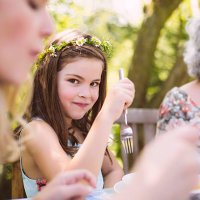 grl sitting between mother and grandmother at a garden table - garden decoration stock pictures, royalty-free photos & images