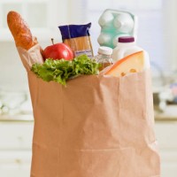 grocery bag full of groceries - food stock pictures, royalty-free photos & images