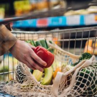 grocery shopping with reusable shopping bag at supermarket - food stock pictures, royalty-free photos & images