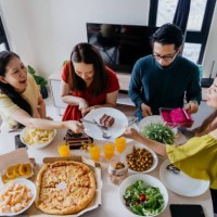 group of asian chinese man and woman having a birthday party at home - junk food stock pictures, royalty-free photos & images