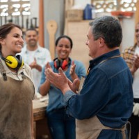 group of carpenters congratulating an apprentice and clapping - home decoration stock pictures, royalty-free photos & images