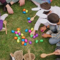 group of children and parents gathering at family garden for easter event - garden decoration stock pictures, royalty-free photos & images