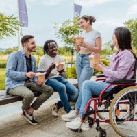 group of diverse friends eating together outdoors - junk food stock pictures, royalty-free photos & images