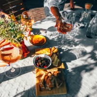 group of female friends drinking wine outside. - food stock pictures, royalty-free photos & images