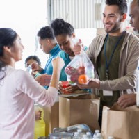 group of food bank volunteers accept and organize donations - food stock pictures, royalty-free photos & images
